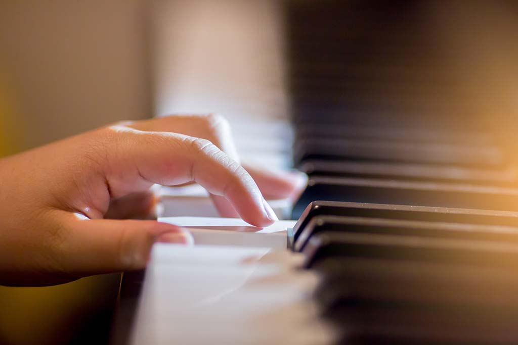 Student taking piano lessons in Marietta, Georgia